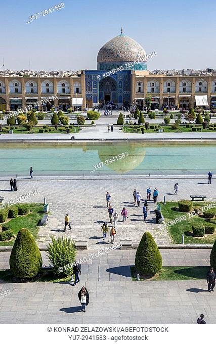 Pool at Naqsh-e Jahan Square (Imam Square, formlerly Shah Square) in centre of Isfahan in Iran. View with Sheikh Lotfollah Mosque