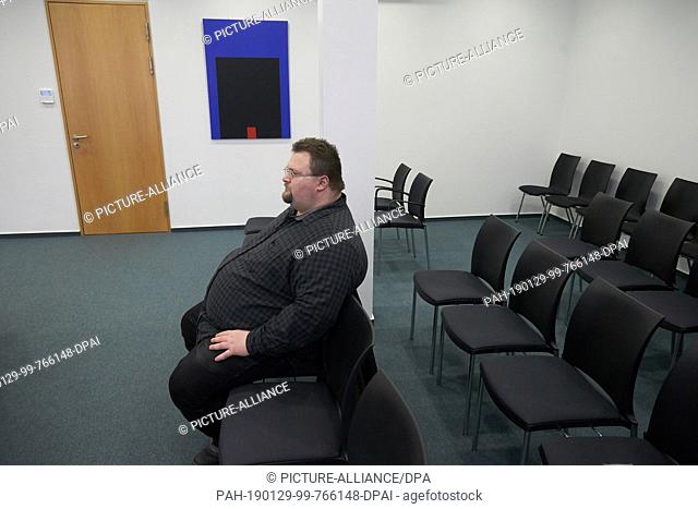 29 January 2019, Rhineland-Palatinate, Koblenz: NPD official Safet Babic sits in a visitor's seat in the negotiation hall of the Constitutional Court of...