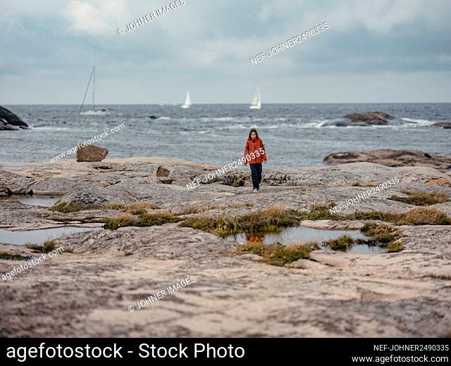 Girl standing at sea