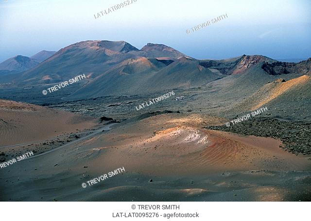 Canary Islands. National park. Volcanic landscape. Black laval sand, dunes.Tour bus