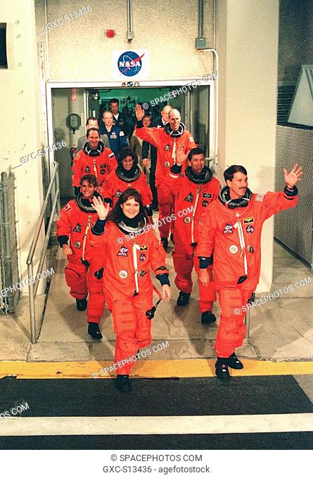 05/27/1999 --- The STS-96 crew wave to onlookers as they walk out of the Operations and Checkout Building enroute to Launch Pad 39B and liftoff of Space Shuttle...