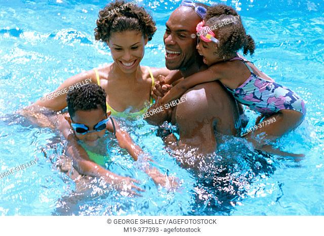 African Amer family in a pool