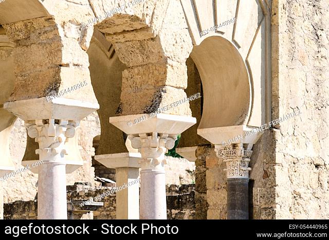 View of horseshoe arches in the ruins of the fortified Arab Muslim medieval palace and city of Medina Azahara in the outskirts of Cordoba