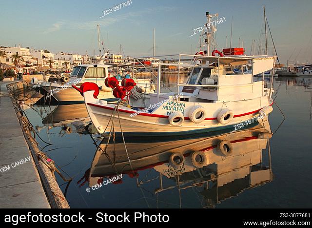 Traditional fishing boats anchored at the harbor in the afternoon light, Naxos Island, Cyclades Islands, Greek Islands, Greece, Europe