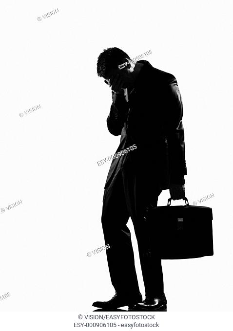 silhouette caucasian business man expressing fatigue despair tired behavior full length on studio isolated white background