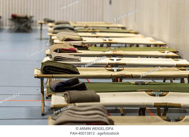 Numerous camp beds stand in a gymnasium, which has been turned into an emergency shelter, in Deggendorf, Germany, 05 June 2013