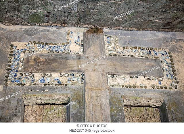 A cross in Capuchos Convent, Sintra, Portugal, 2009. Founded in 1560 by the son of the governor of India, this convent is located on a hilltop and was carved by...