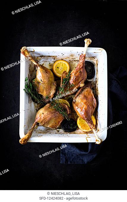 Goose legs with orange and thyme