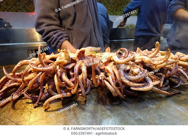 XI'AN, CHINA. Grilled squid Street food. Xi'an, formerly romanized as Sian, is the capital of Shaanxi province, located in the northwest of the People's...