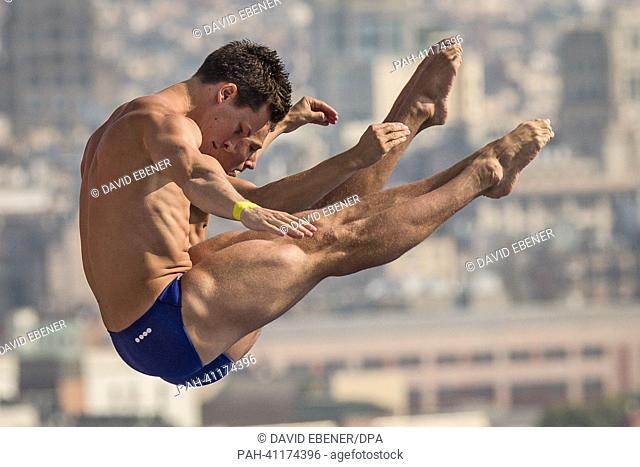 Patrick Hausding (Front) and Sascha Klein of Germany in action during the men's 10m Synchro Platform diving preliminaries of the 15th FINA Swimming World...