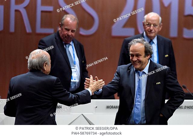 FIFA President Joseph Blatter (L) and UEFA President Michel Platini shake hands during the 65th FIFA Congress with the president's election at the Hallenstadion...