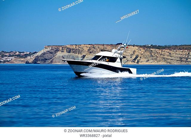 View of a fast vacation yatch speeding on the water