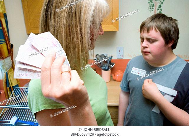 Care home worker taking money off boy with Down's Syndrome