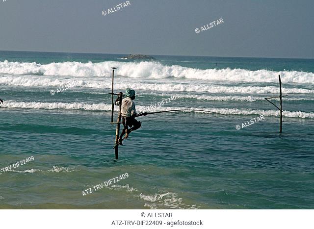 LONE STILT FISHERMAN; WELIGAMA, SRI LANKA, ASIA; 18/03/2013