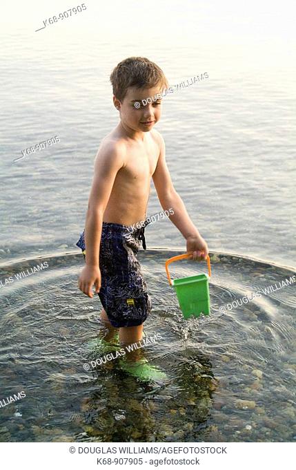 Five year old boy in water at Porpoise Bay, BC, Canada