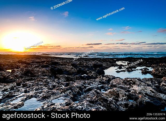 Scenic view of rocky beach at sunset, Cotillo, Fuerteventura, Canary Islands, Spain