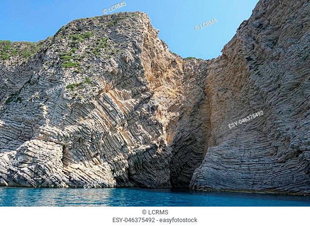 paradise beach of Liapades at Corfu Island (Greece). Sedimentary rock cliff of chalk rocks