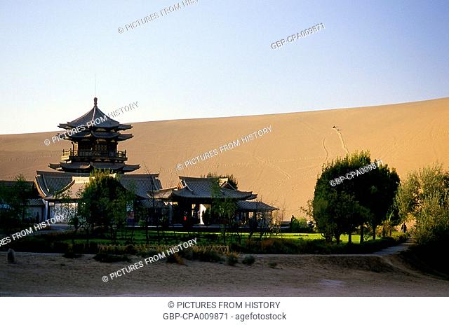 China: Temple next to the singing sand dunes of Mingsha Shan (Mingsha Hills) in the Kumtagh Desert, Gansu Province