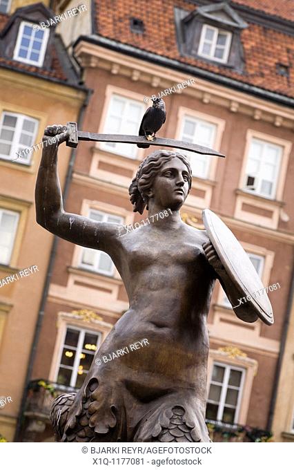 The Warsaw Mermaid statue, bird sitting on the sword  Old Town Market Place, Warsaw Poland