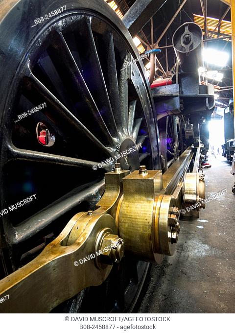 vintage steam locomotive in the maintenance shed at Loughborough station, on the Great Central Railway in Leicestershire, UK