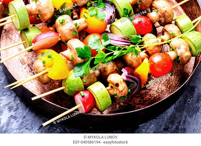 Raw diet kebab from fresh vegetables on skewers. Vegetables for grilling