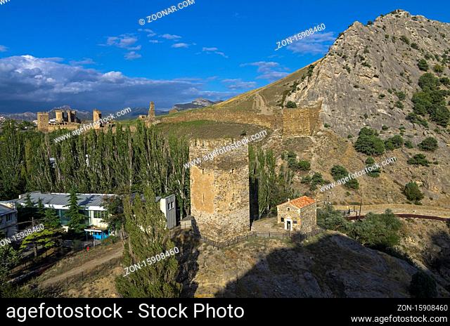 Medieval tower and old Christian temple near the ruins of the Genoese fortress in Sudak, Crimea