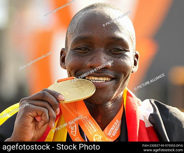 27 August 2023, Hungary, Budapest: Athletics: World Championship, Marathon, Men. The new world champion Victor Kiplangat (Uganda) cheers at the finish line