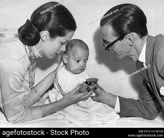 Athol Shmith, his wife ""Bambi"" Tuckwell and son Michael. That little camera is really a cigarette lighter. May 24, 1950