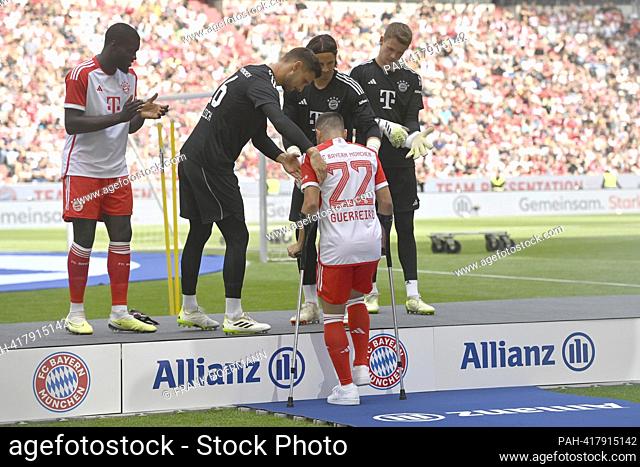 the injured Raphael GUERREIRO (FC Bayern Munich) comes on crutches. Team presentation FC Bayern Munich season 2023/2024 on July 23, 2023 in the ALLIANZARENA