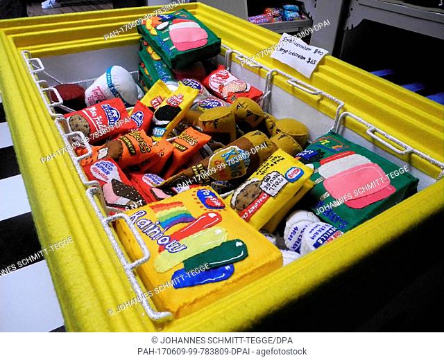 Looking inside a freezer chest of the grocery store '8 'till late' by the British artist Lucy Sparrow in which all products are made out of felt in New York