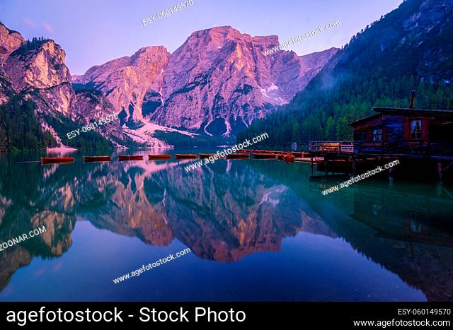 Beautiful landscape of Braies Lake Lago di Braies, romantic place with wooden bridge and boats on the alpine lake, Alps Mountains, Dolomites, Italy, Europe