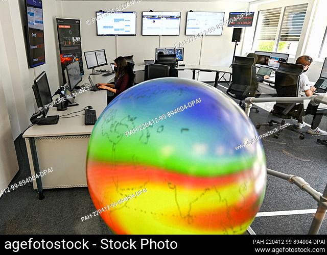 12 April 2022, Hessen, Darmstadt: Engineers sit in front of their monitors at the European Space Agency's (ESA) new Space Safety Center