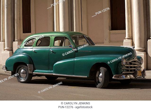 Classic American green Pontiac Silver Streak car parked in street at Havana, Cuba, West Indies, Caribbean, Central America