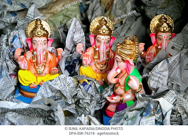 Idols of the Elephant Headed God ; Ganesh ganpati Festival for sale procession Pune ; Maharashtra ; India
