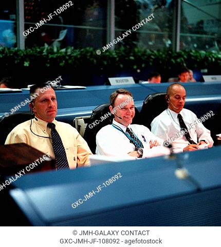 Three astronauts await the countdown for STS-99 from the spacecraft communicator (CAPCOM) console at JSC's Mission Control Center (MCC)