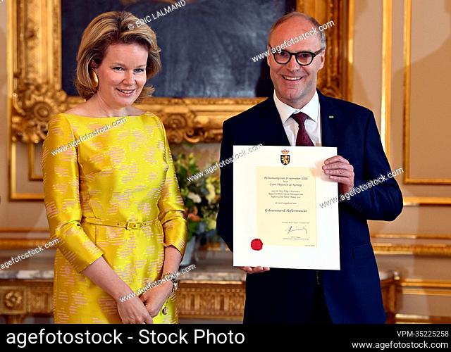 Queen Mathilde of Belgium and Filip Verstreken of Jaguar Land Rover Belux NV pictured during a royal reception with the newly appointed suppliers holding a...