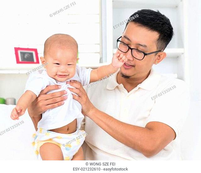 Father playing with his baby boy