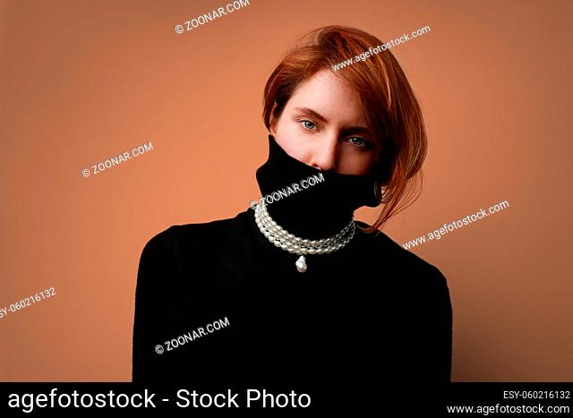 Close-up of young caucasian woman, isolated on light background. High quality photo