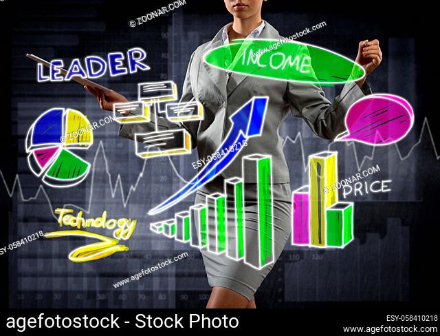 Close view of businesswoman drawing colorful diagrams and graphs on screen