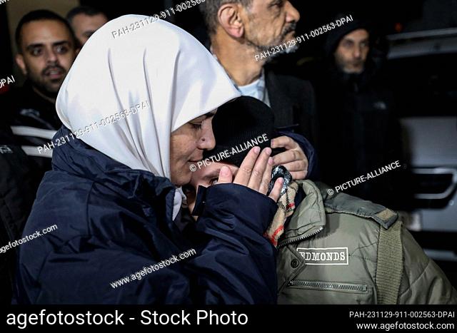 29 November 2023, Palestinian Territories, Ramallah: A Palestinian prisoner is welcomed by friends and family after being released from an Israeli jail