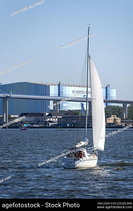 13 August 2020, Mecklenburg-Western Pomerania, Stralsund: A sailing boat sails on the Strelasund, an inlet of the Baltic Sea