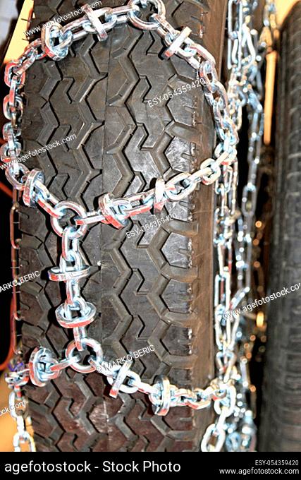 Snow chain attached to tyre for winter