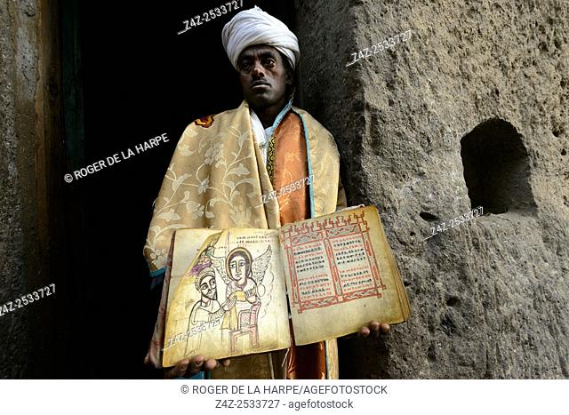 Priest with anceint religious relics. Asheton Maryam Monastery. Lalibela. Ethiopia