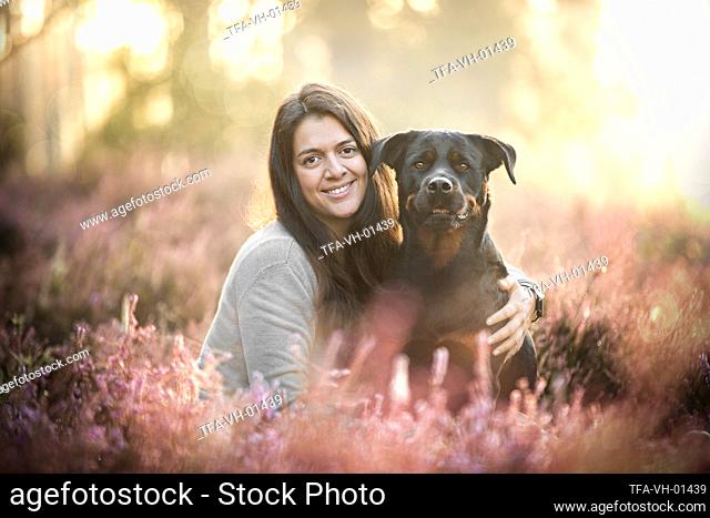 young woman with Rottweiler