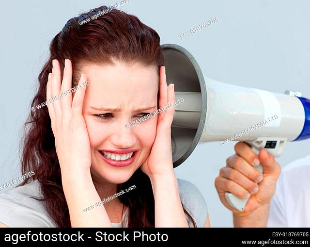 Portrait of a businesswoman getting nervous with a megaphone