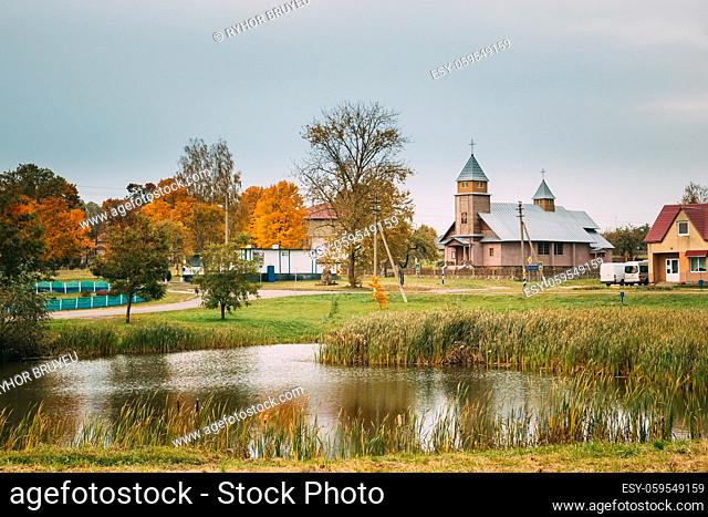 Porplishte, Dokshitsy District , Vitsebsk Region, Belarus. Old Wooden Catholic Church Of The Virgin Mary In Autumn Day