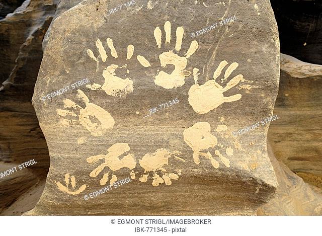Mud handprints on a rock, El Ghessour, Tassili du Hoggar, Wilaya Tamanrasset, Algeria, North Africa