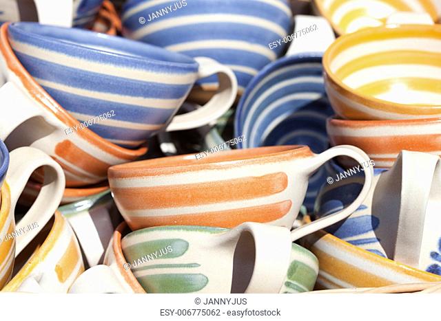 ceramic cups in a basket at the fair
