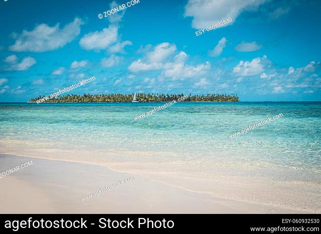 beautiful beach, blue sky and palm tree island -