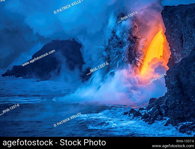A Lava fall pours from a lava tube 60 feet high, the heat and pressure of super heated ocean steam creates powerful explosions, Hawaii Volcanoes National Park